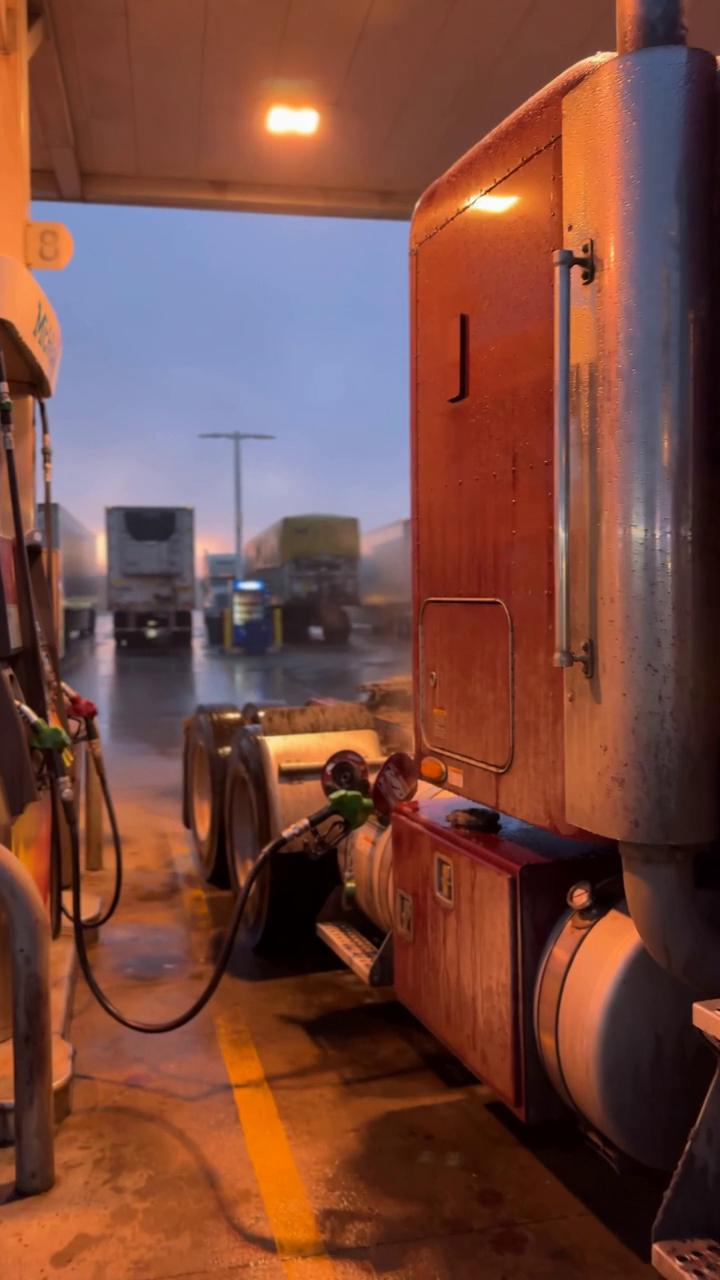Semi truck refueling with a diesel nozzle